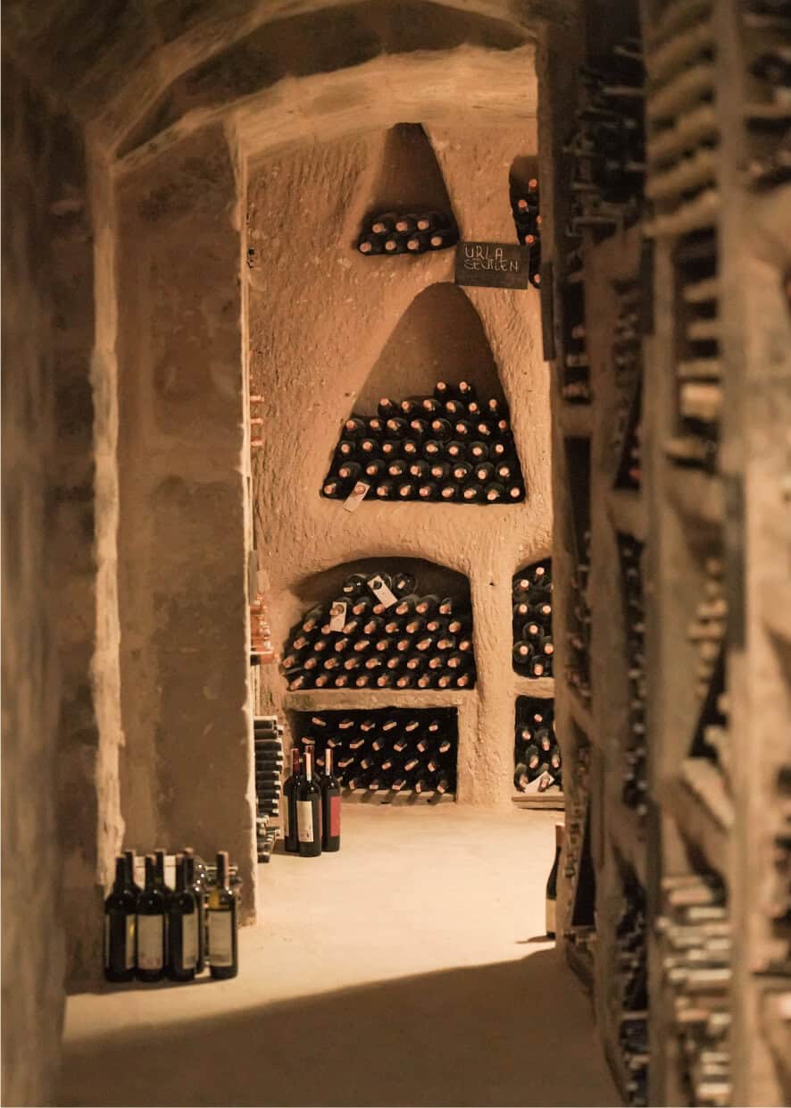 underground cave wine cellar with bottles