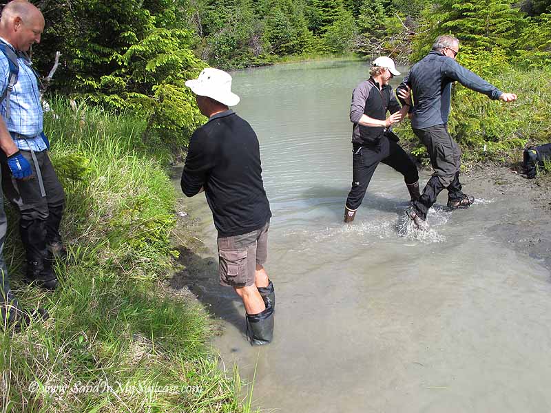 Un-Cruise Adventures Alaska - hiking across a stream
