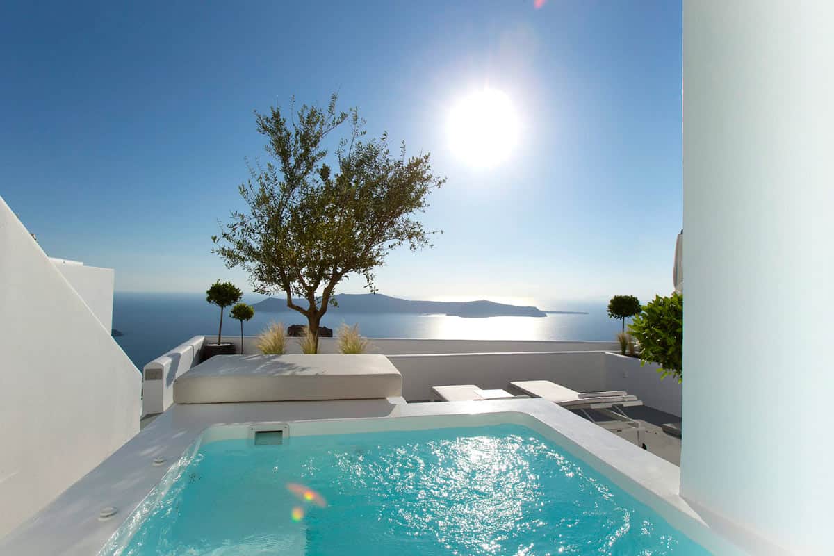 Turquoise colored private plunge pool overlooking Aegean Sea