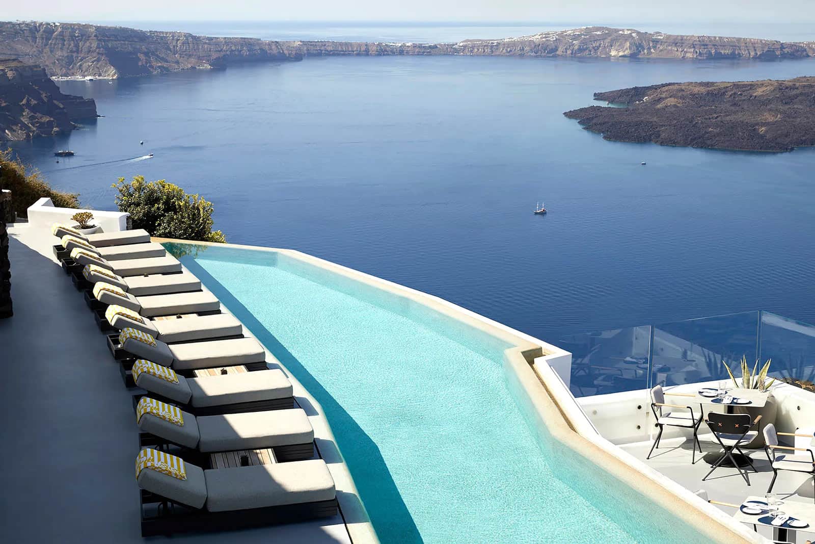 Lounge chairs above the Grace Hotel infinity pool