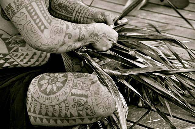 A Tahitian with traditional tattoos - photo Tahiti Tourisme