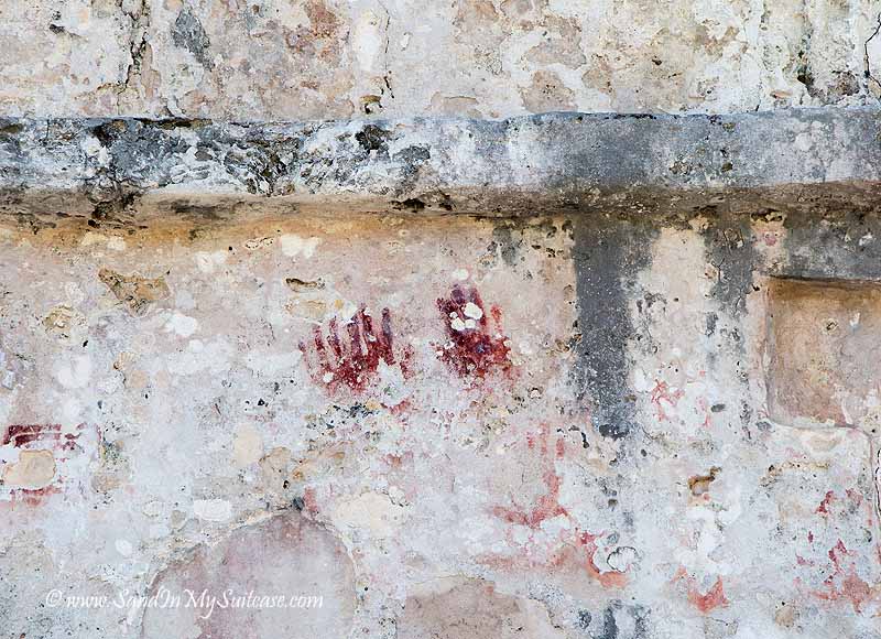 mayan ruins of tulum - red handprints