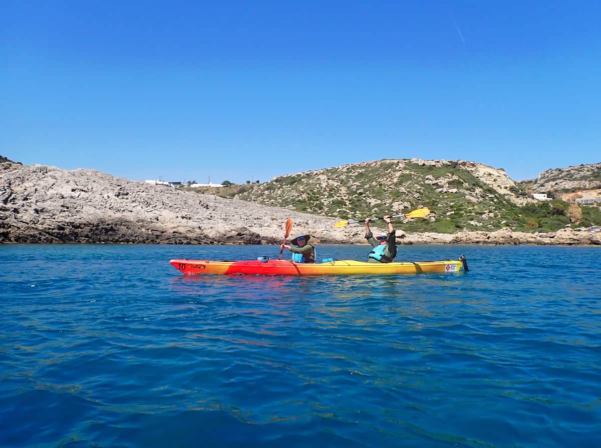 Couple sea kayaking in Rhodes, Greece