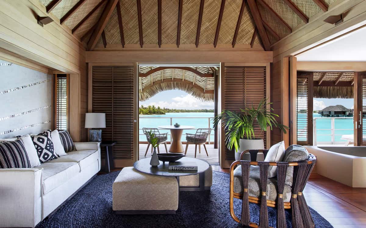 The living room in a plunge pool overwater bungalow