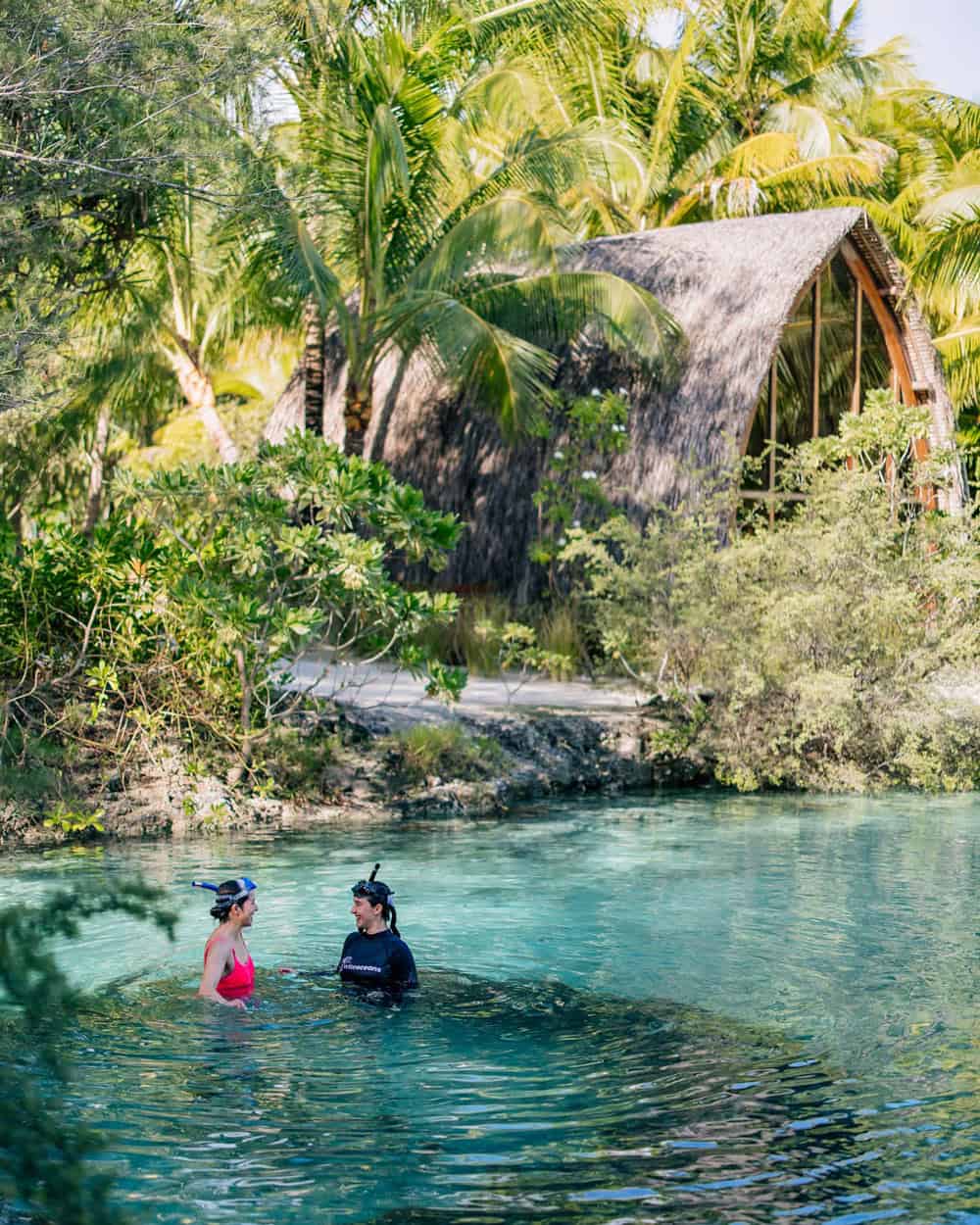 Two snorkelers in Four Seasons lagoon sanctuary