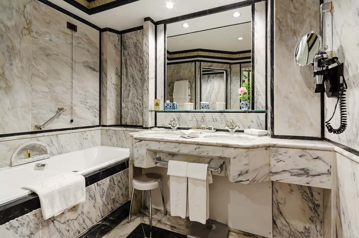 Gray and white marble bathroom in a Lapa Palace Hotel room