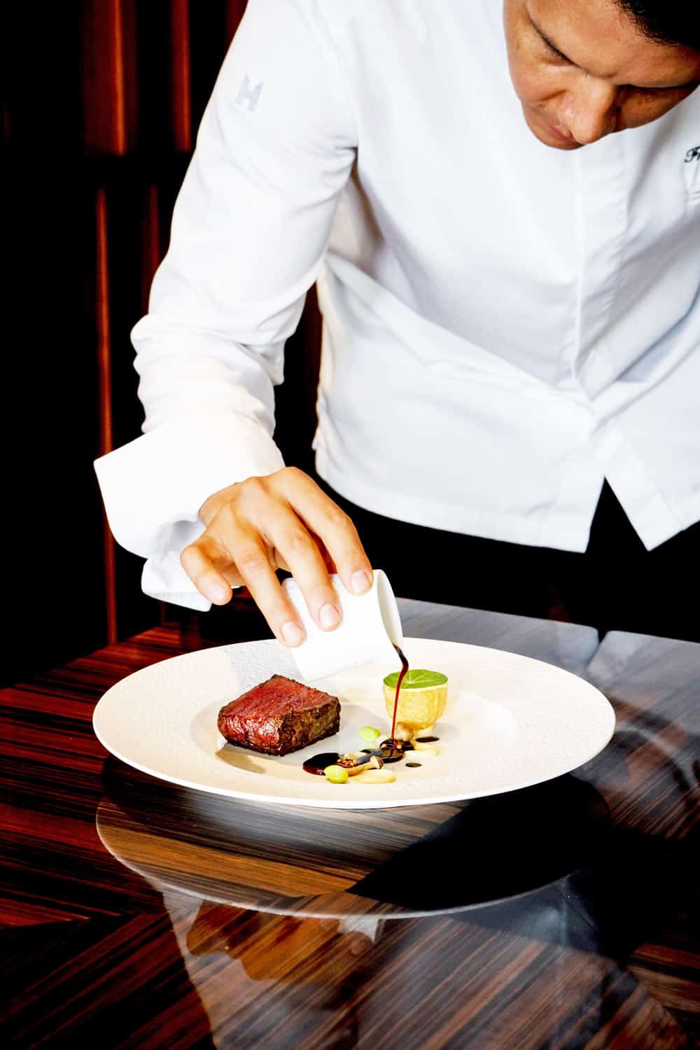 Preparing dish at Cocina de Autor