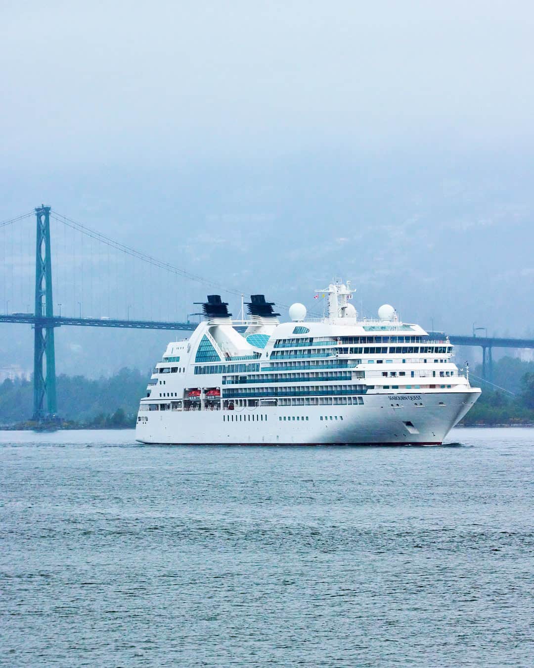Seabourn Quest sailing under the Lion's Gate Bridge in Vancouver