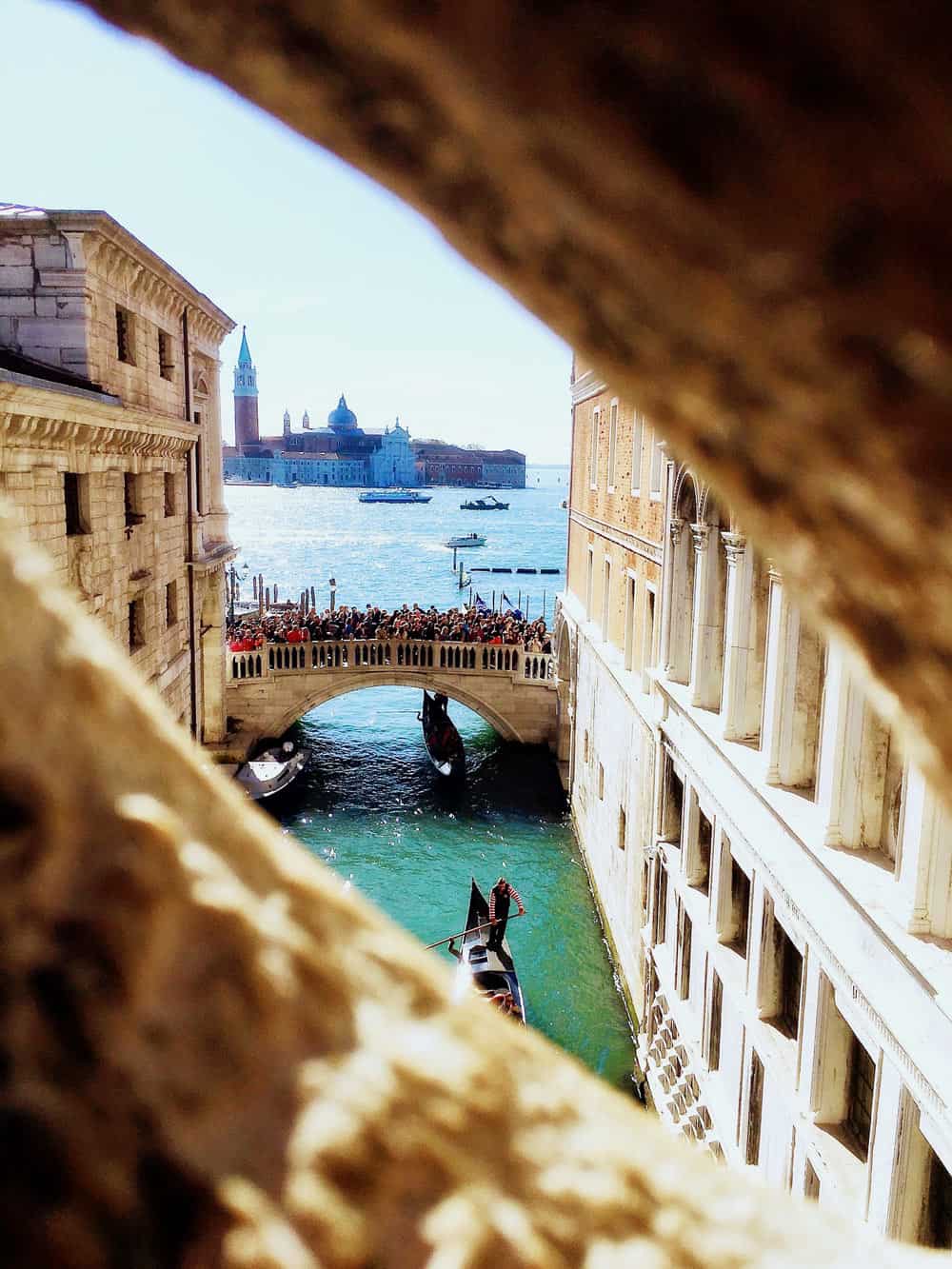 Peering out from the Bridge of Sighs