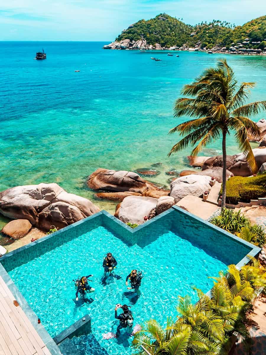 People take SCUBA lessons in the pool at Jamahkiri Dive Resort, Koh Tao
