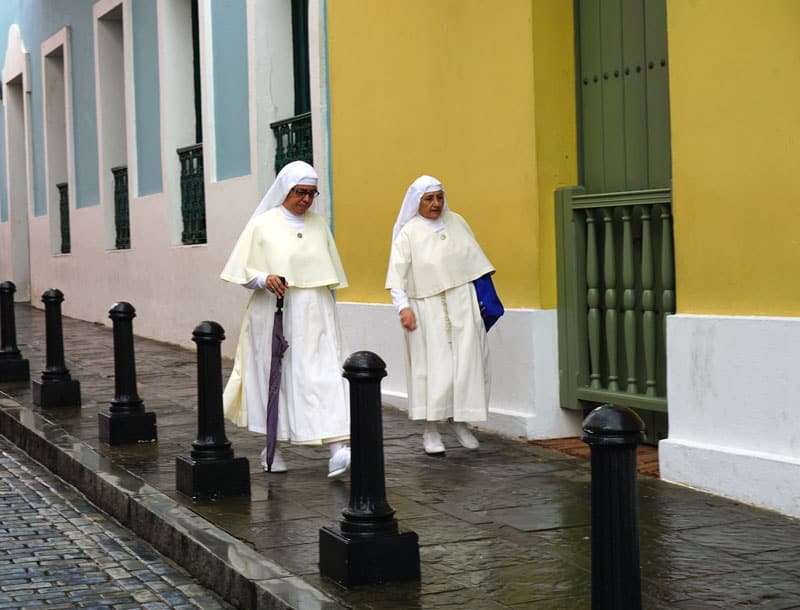 Nuns stroll a street in Old San Juan, Puerto Rico.