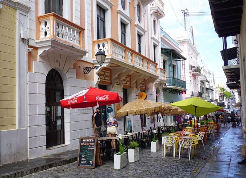 Cobblestone street in Old San Juan with outdoor cafes