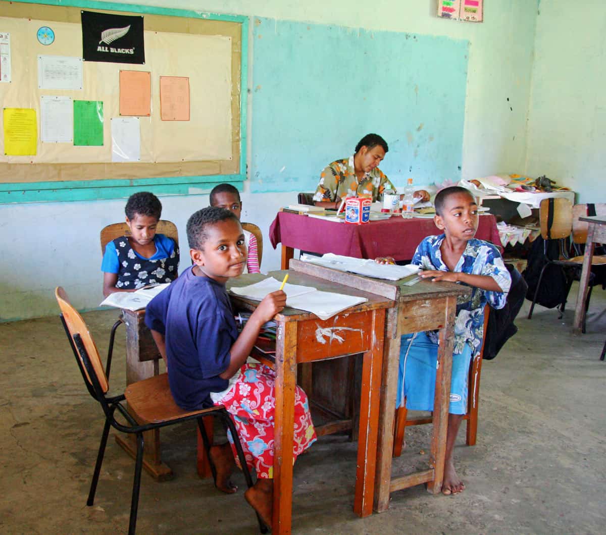 Fijian school children at their desks in class