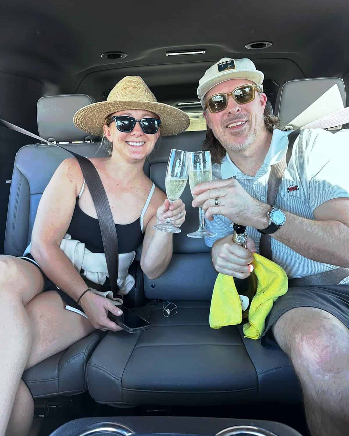 Couple enjoying champagne during a private Cabo airport transfer with All Ways Cabo Transportation