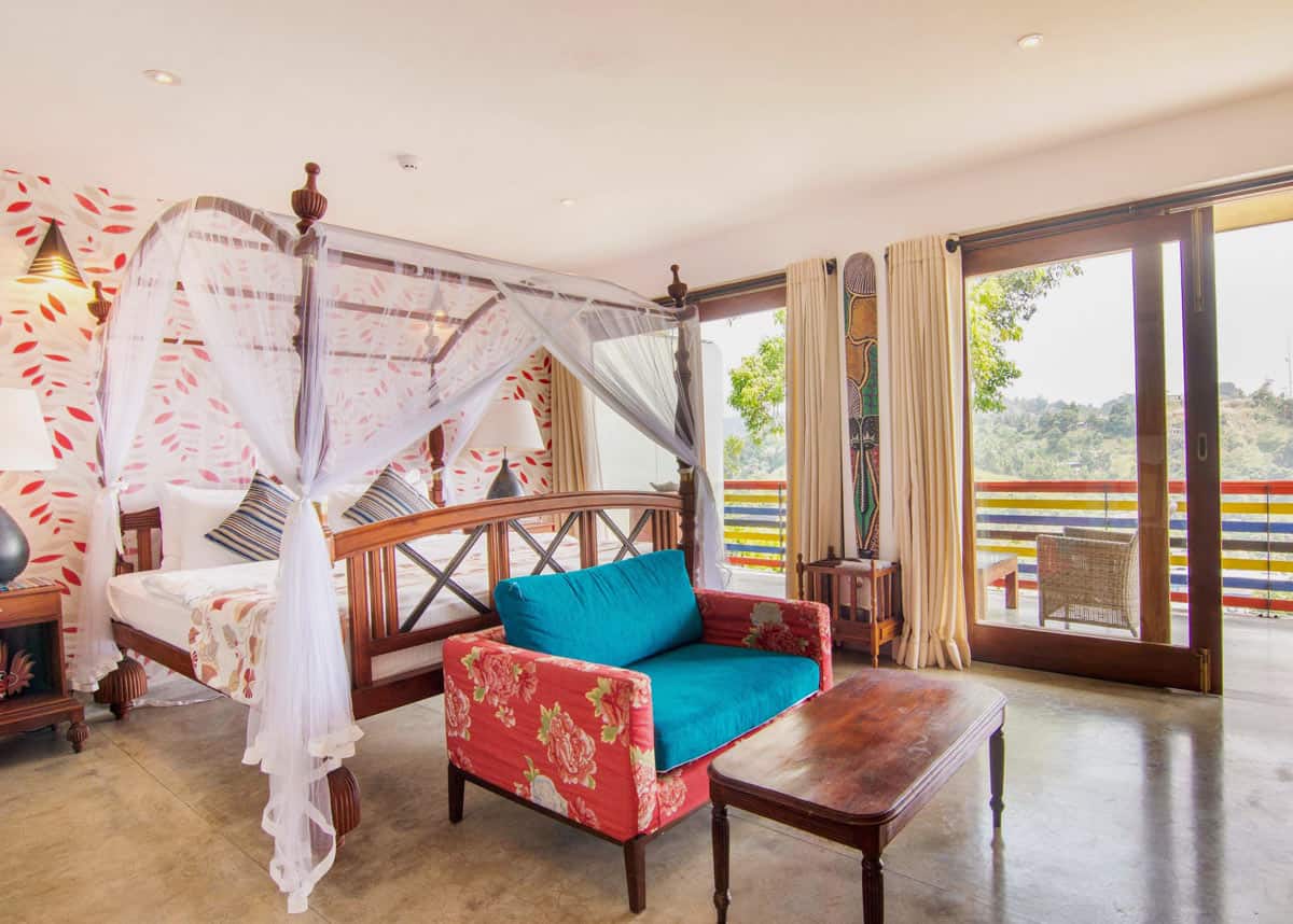 Four poster bed in Elephant Stables room, with hardwood floors