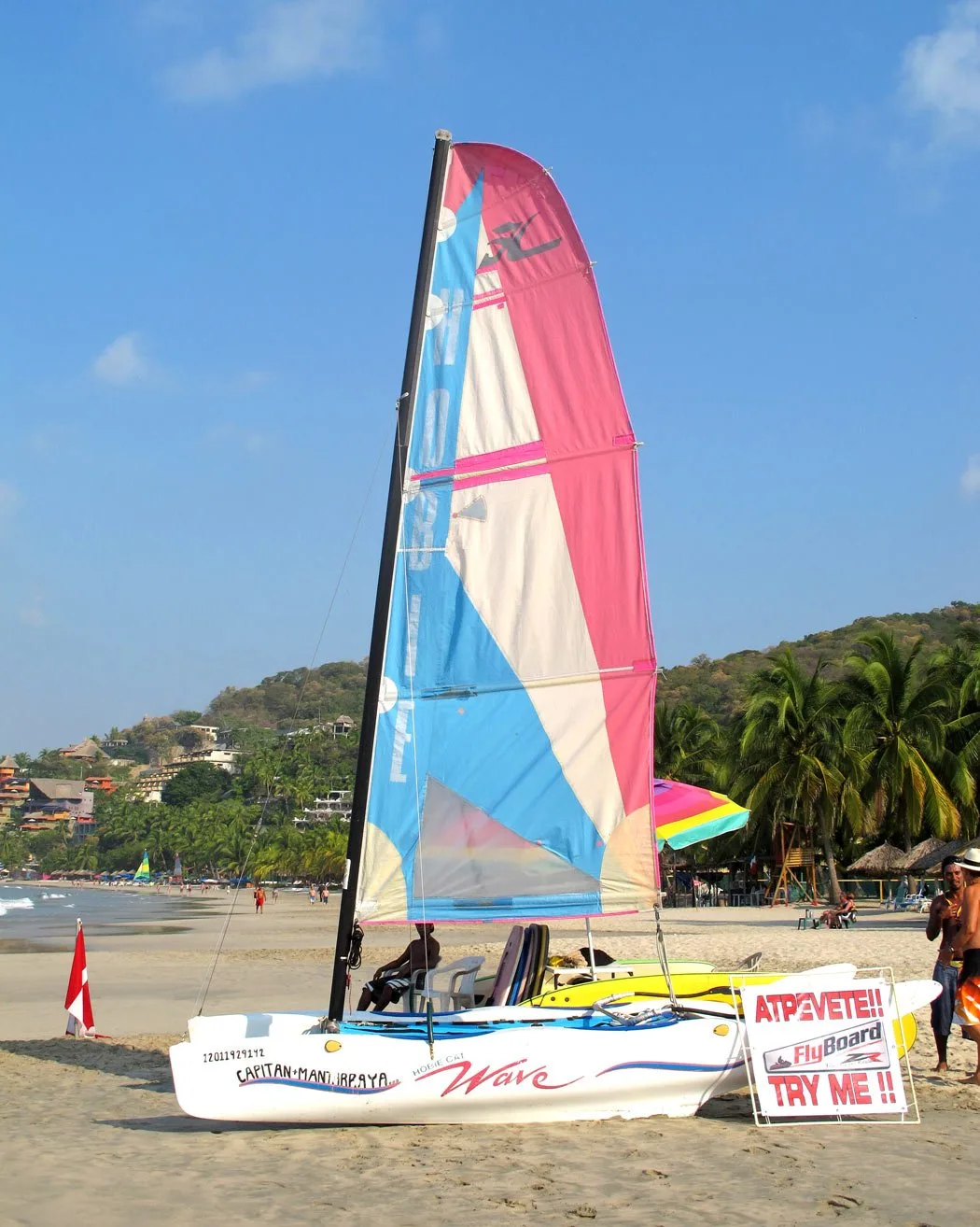 https://sandinmysuitcase.com/wp-content/uploads/2019/10/Sailboat-on-Playa-La-Ropa.jpg.webp