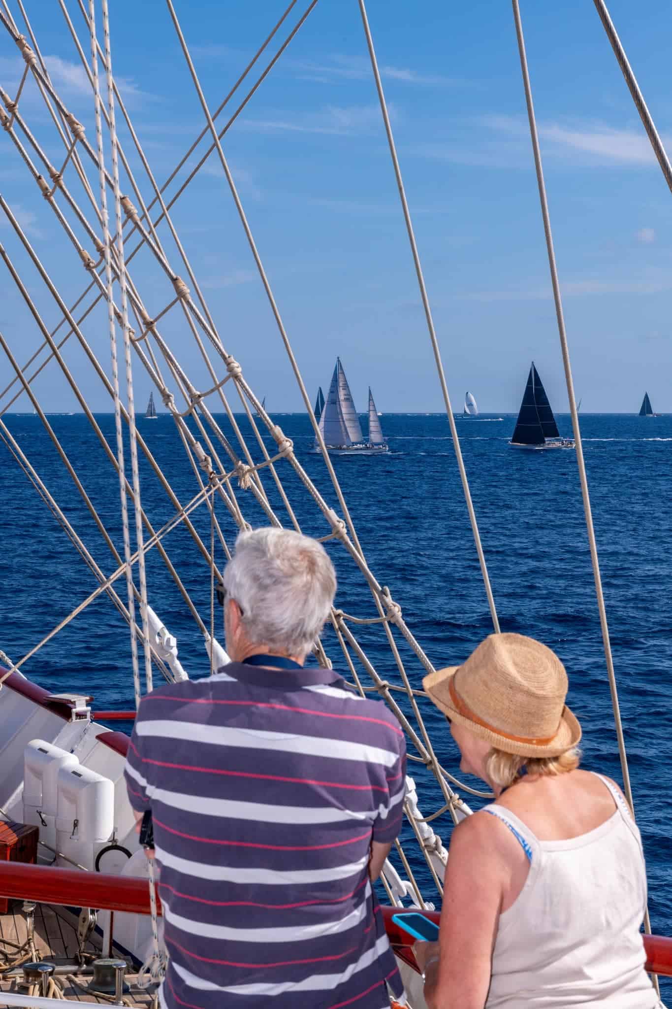 Couple watching sail boats from the Star Flyer