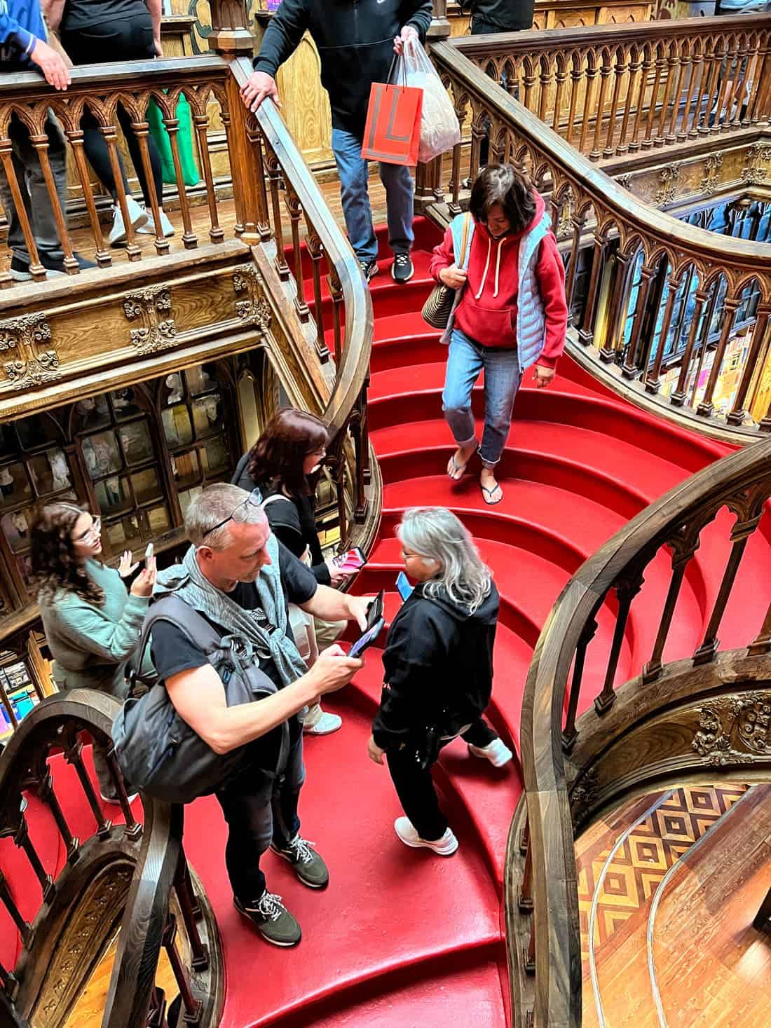 Famous red stairway at Livraria Lello bookshop