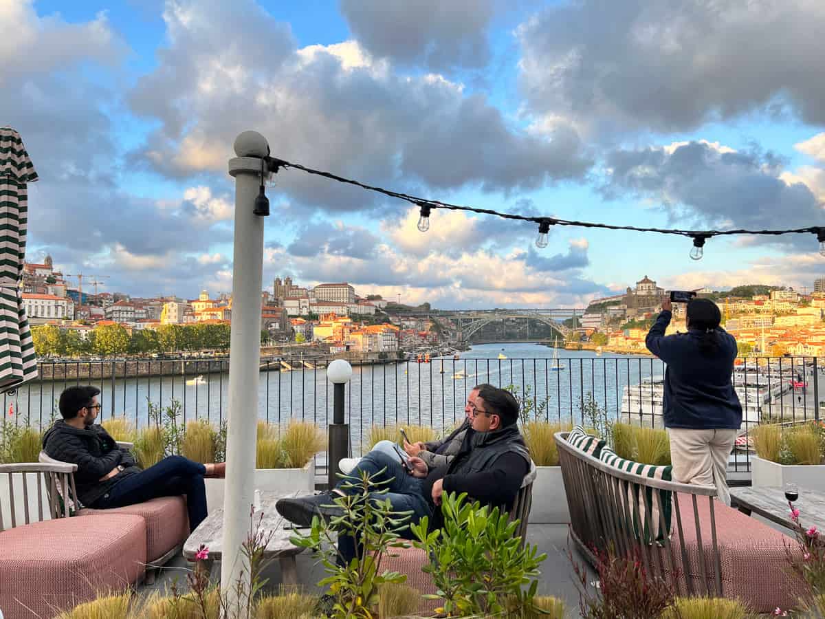 Guests enjoy Porto views and sunset drinks at the Rebello Hotel & Spa.