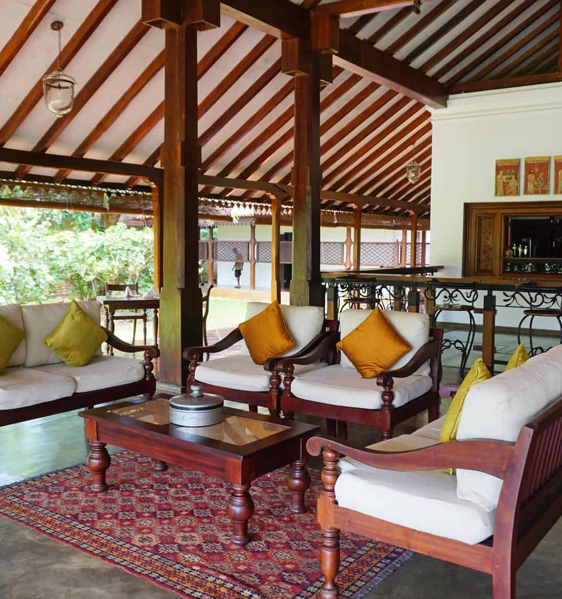 Traditional wood-beamed lounge with antique-style furniture inside the historic mansion at Uga Ulagalla