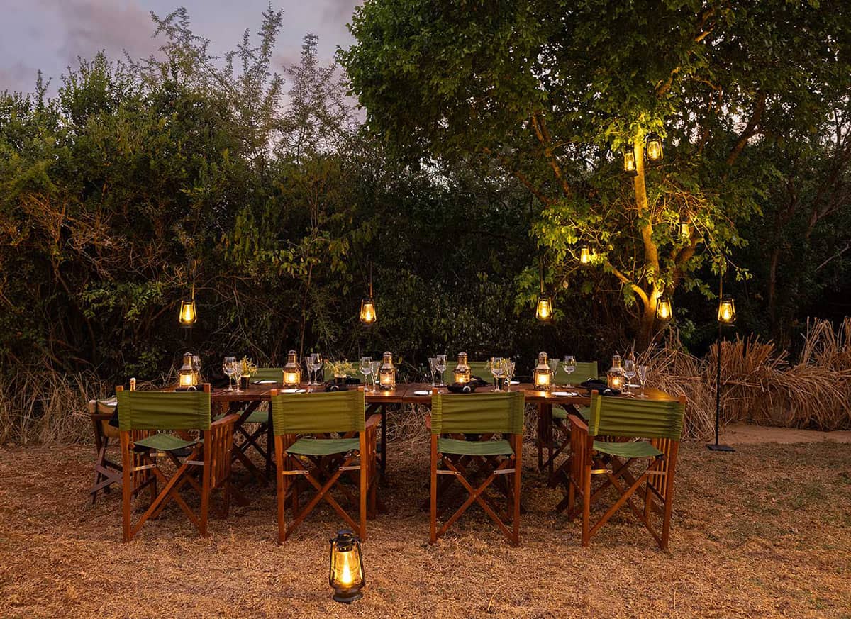 Lantern-lit outdoor dinner table at Taru Villas Villu, near Wilpattu National Park
