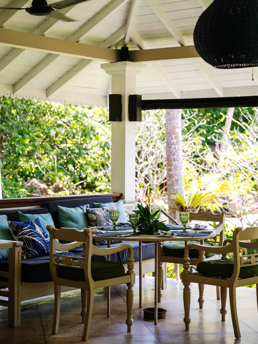 Colonial-style veranda with table and chairs