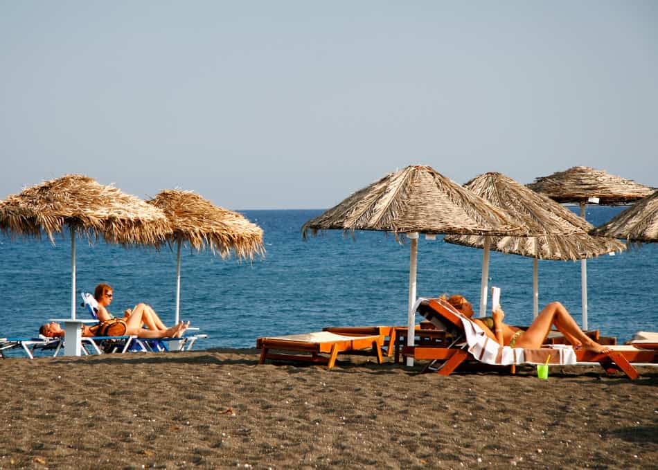 Soaking up the sun on Perissa Beach, Santorini