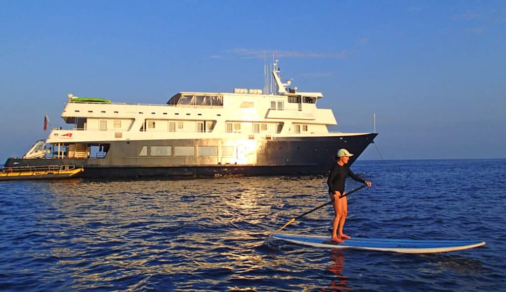 Stand-up paddle boarding by the Safari Explorer on our UnCruise Hawaii trip