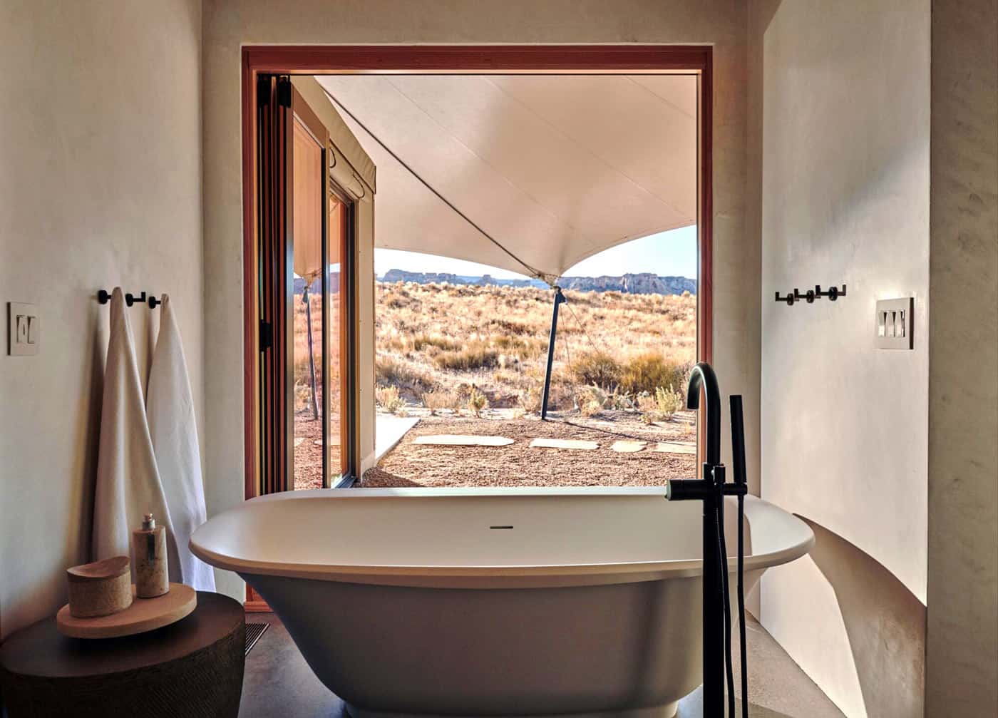 Bathtub with a desert view at Amangiri's Camp Sarika
