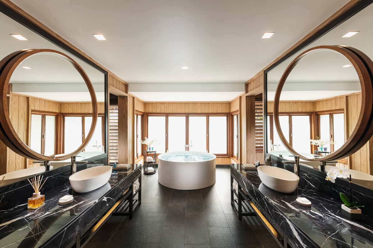 Black marble bathroom of Conrad Nui deluxe overwater villa