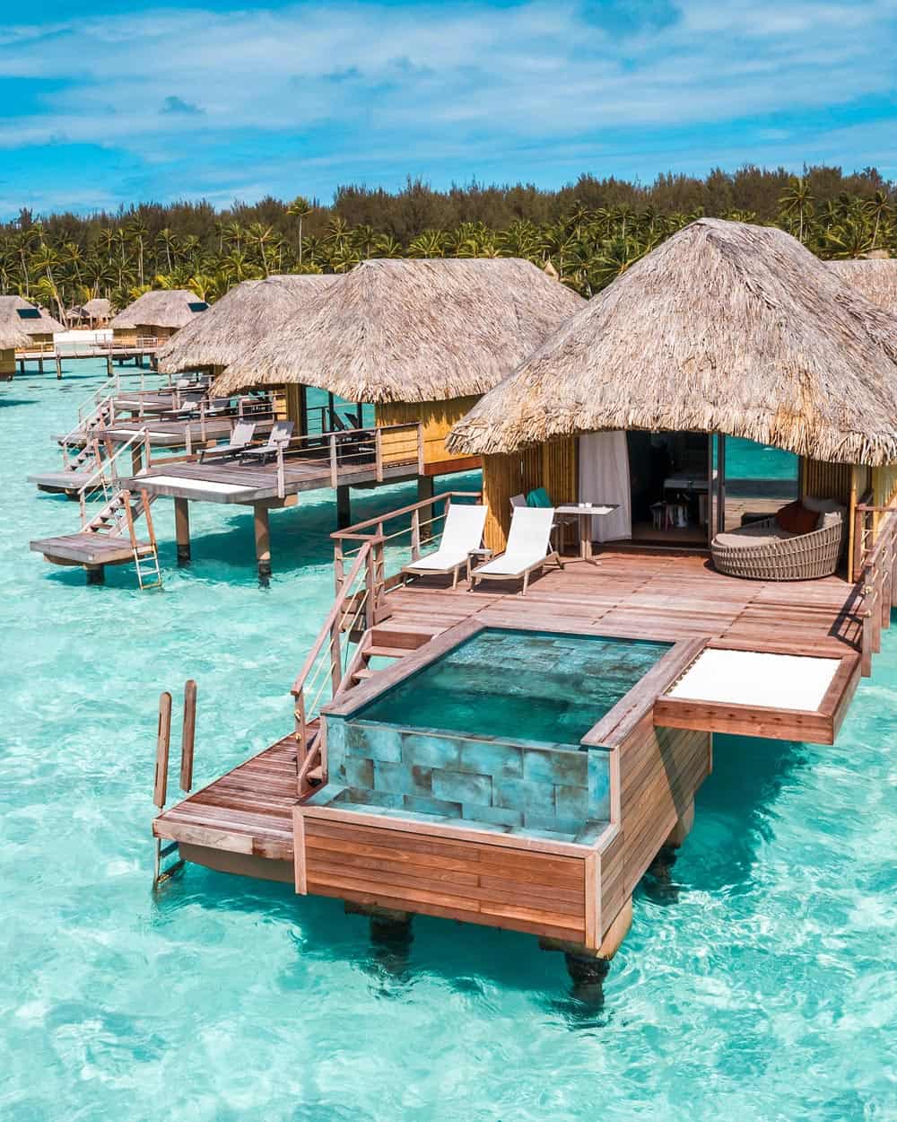 An overwater bungalow with a private pool at Le Bora Bora