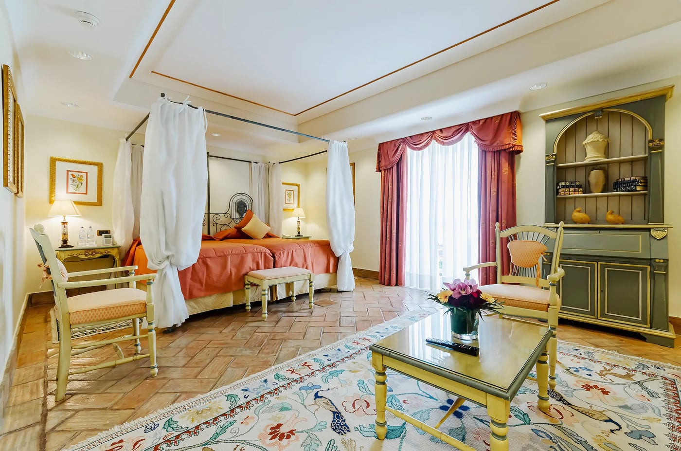 A canopied bed, terracotta floors and timeless European charmโa room at Olissippo Lapa Palace hotel in Llisbon