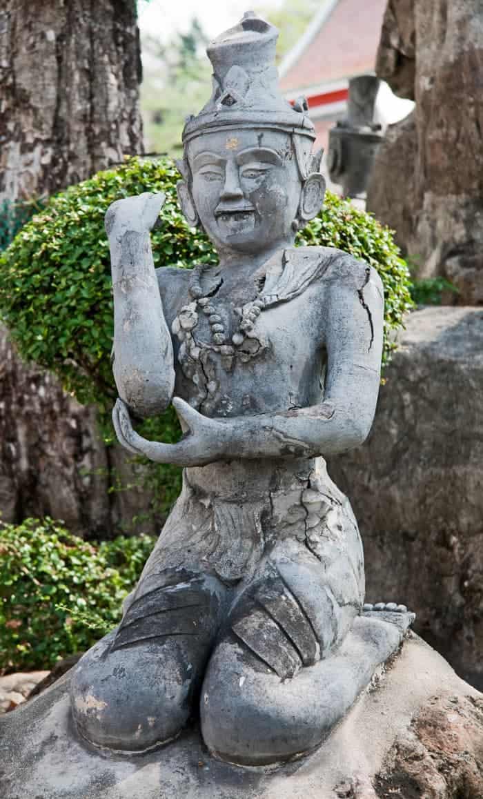 A Thai sculpture of person doing Thai massage