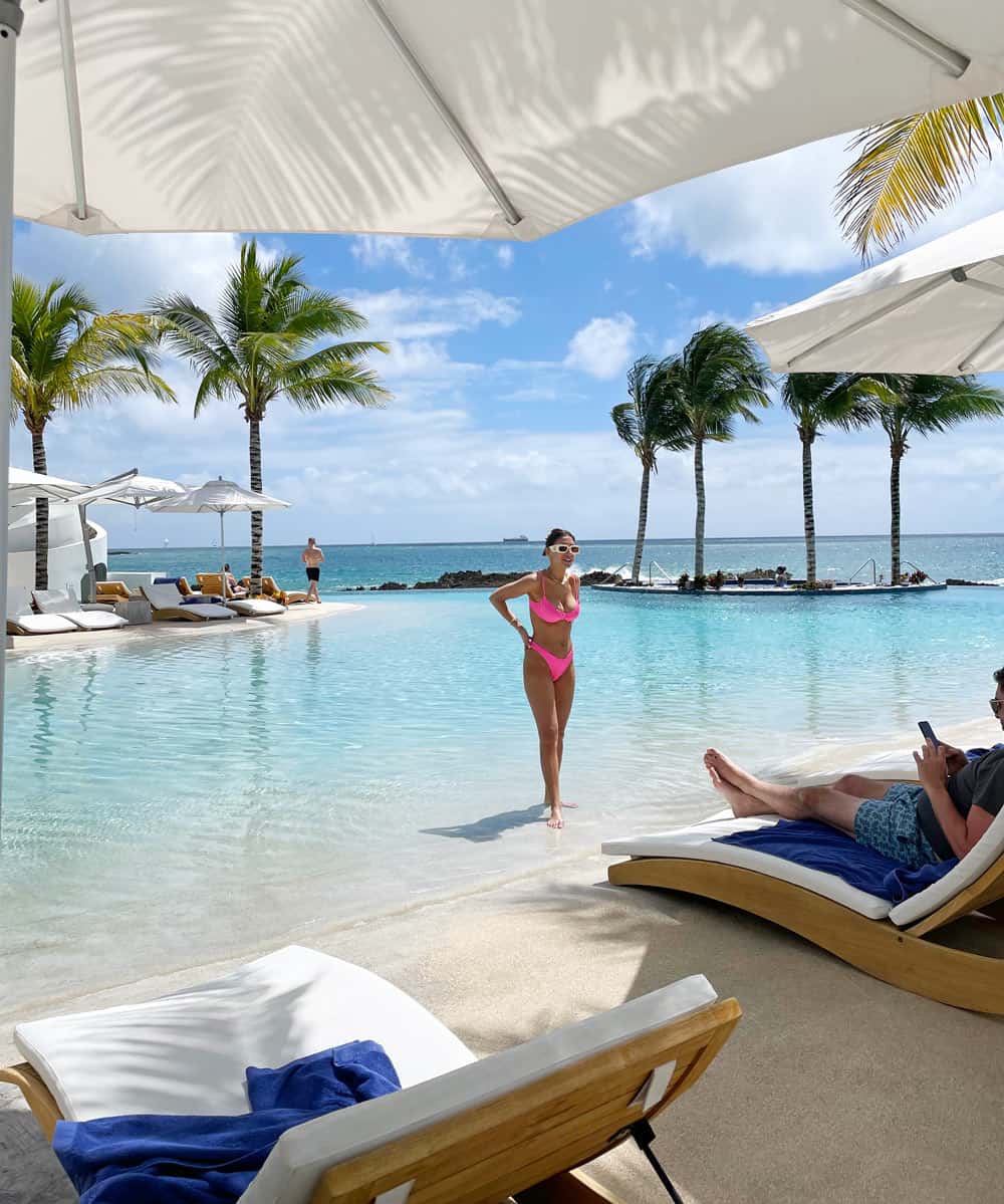 Woman in pink bikini by the pool at The Morgan Resort & Spa