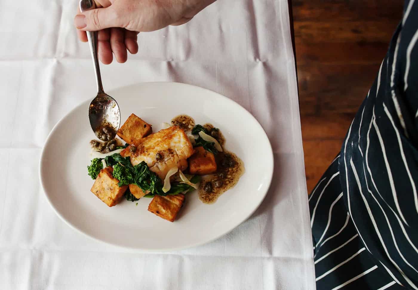 White fish with vegetables on a plate