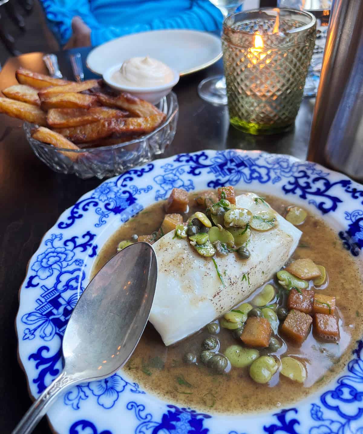 Halibut with fava beans and capers in a brown butter sauce