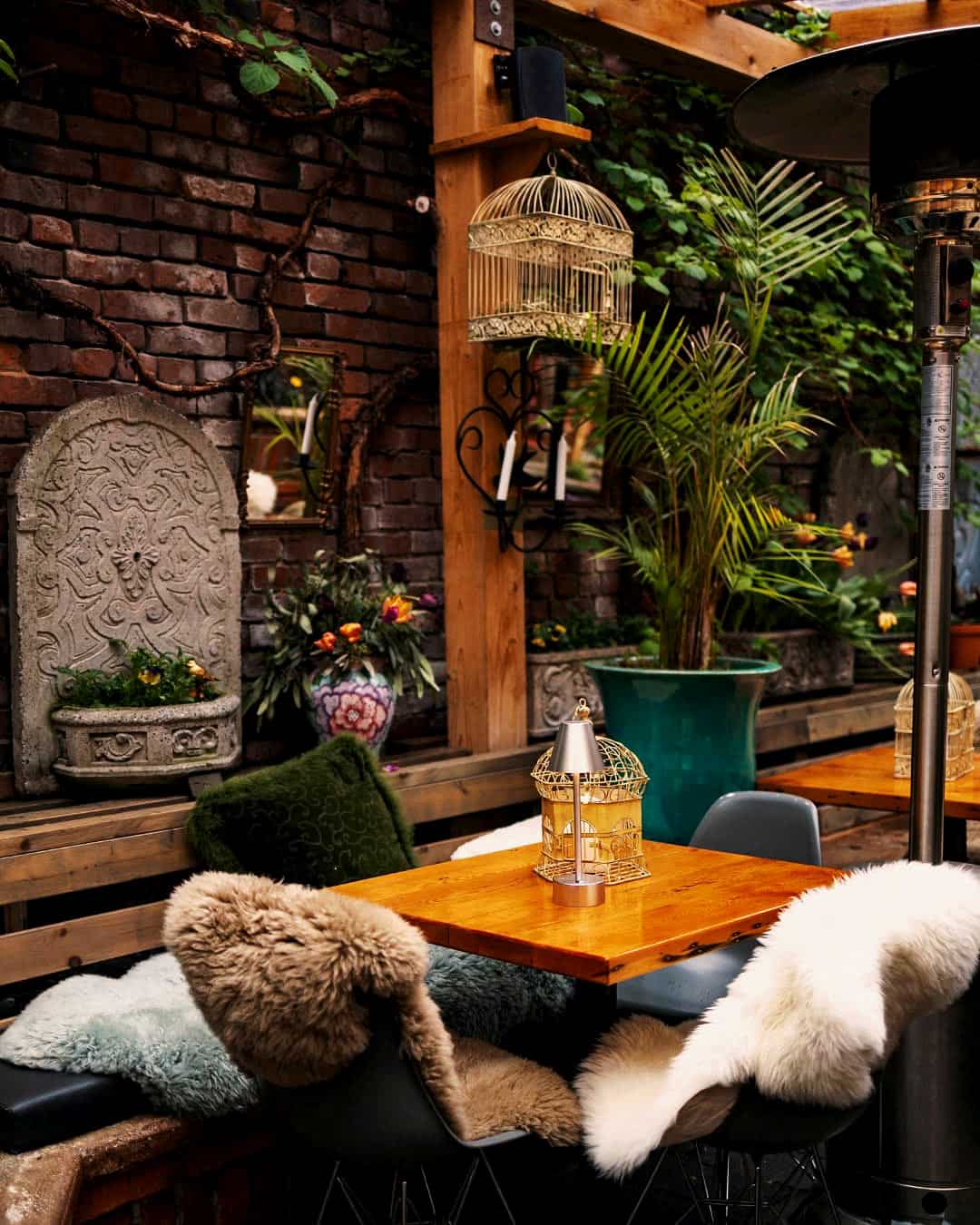 Table and chairs covered with furs at Il Terrazzo restaurant, Victoria