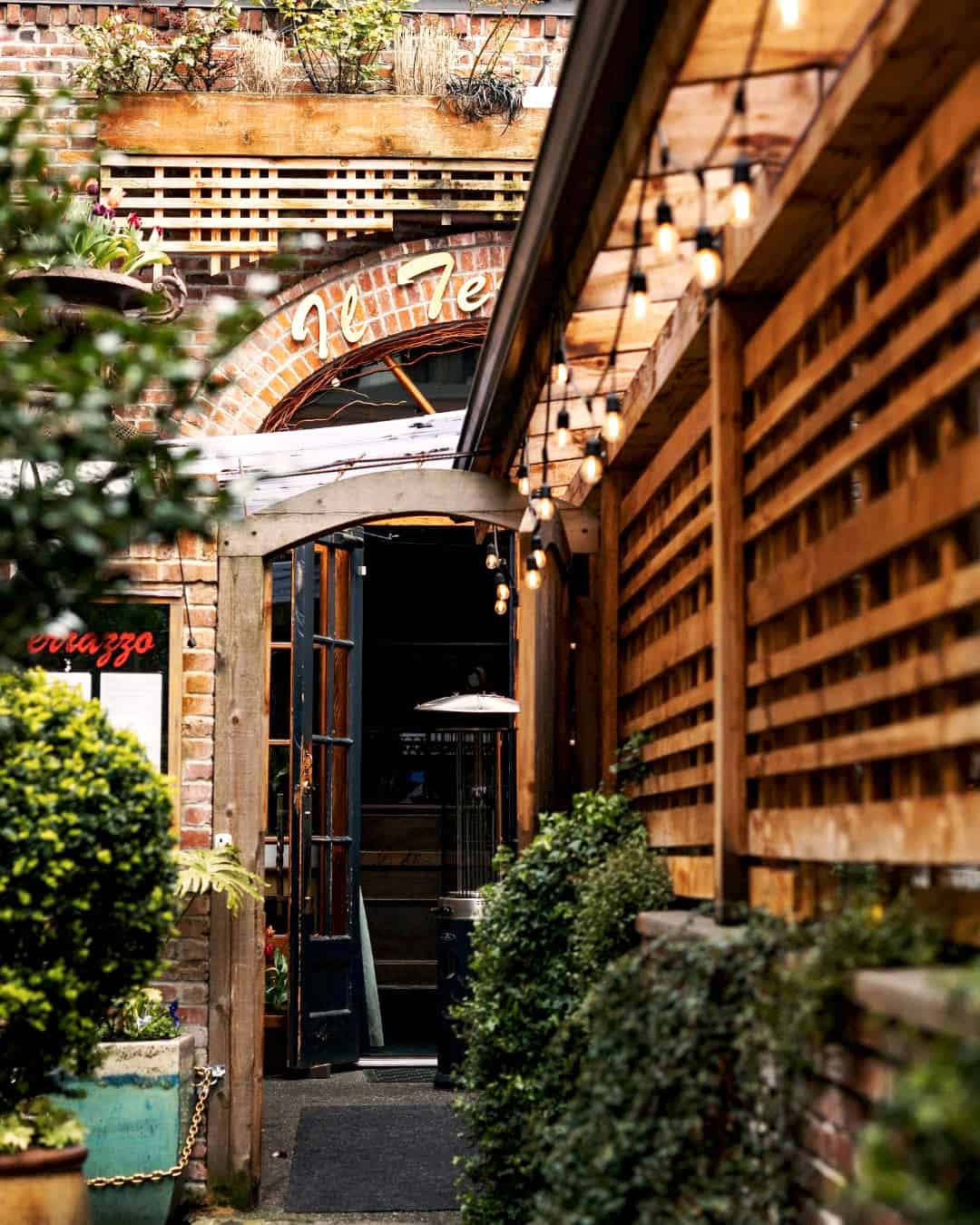 Ivy and plants line entrance to Il Terrazzo restaurant