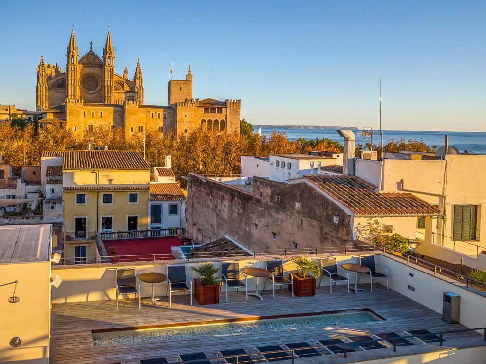 Glorious views of Palma's cathedral at sunset from the rooftop pool of Petit Palace Hotel Tres