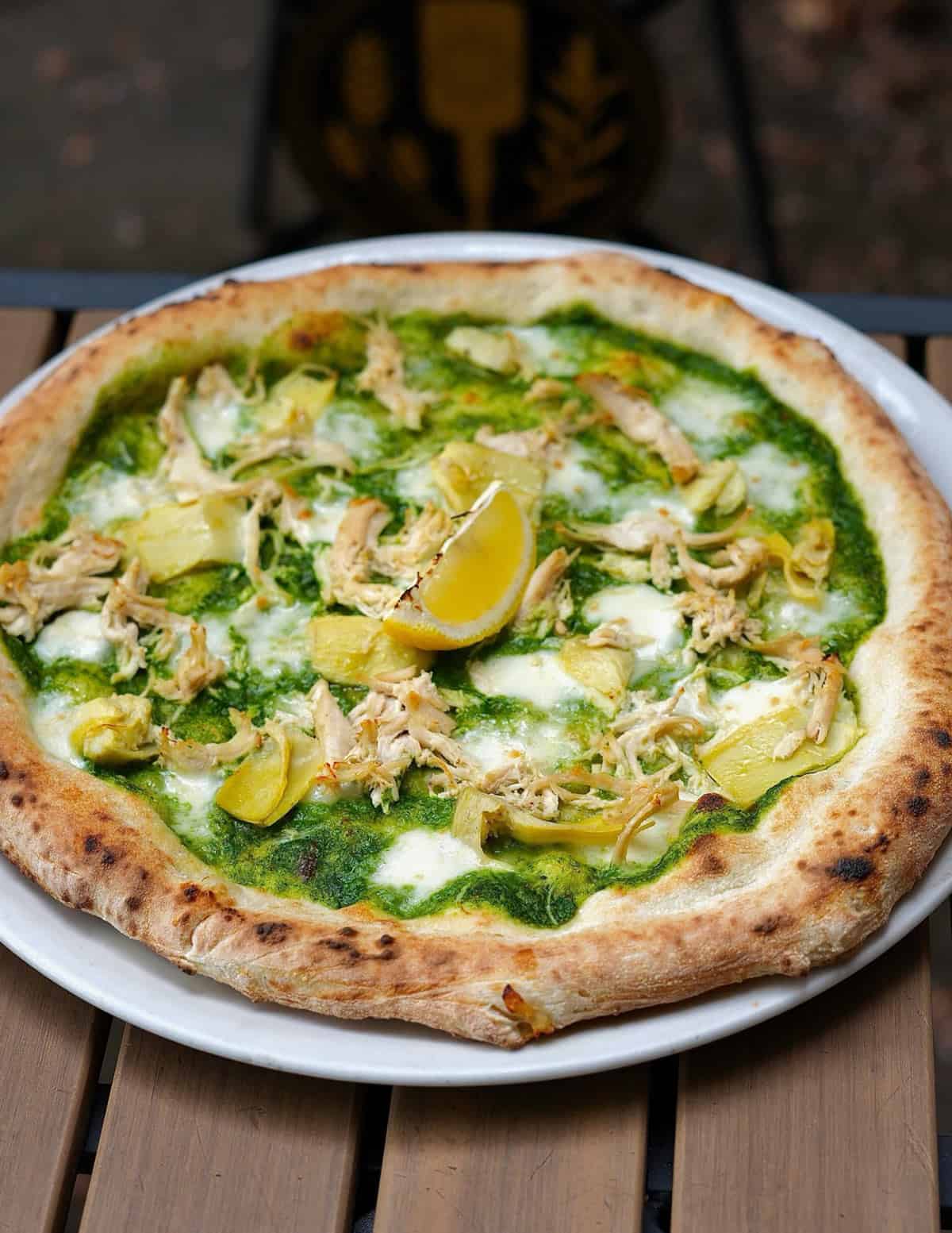 Spinach, chicken, crema and artichoke pizza