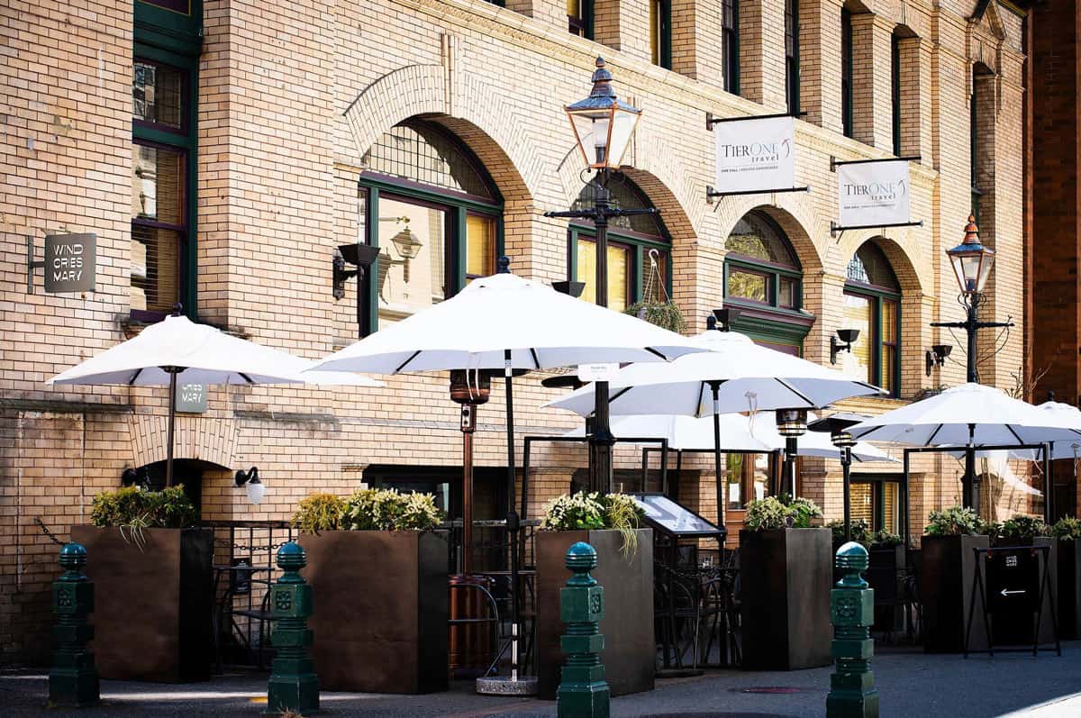 White umbrellas on the outside patio at Wind Cries Mary, Victoria
