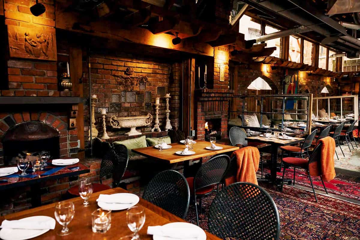 Dark interior of brick-walled Il Terrazzo restaurant