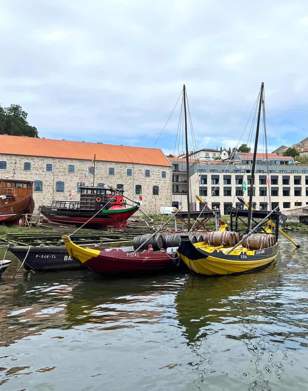 Yello and red Rabelo boats on the Douro River in Porto