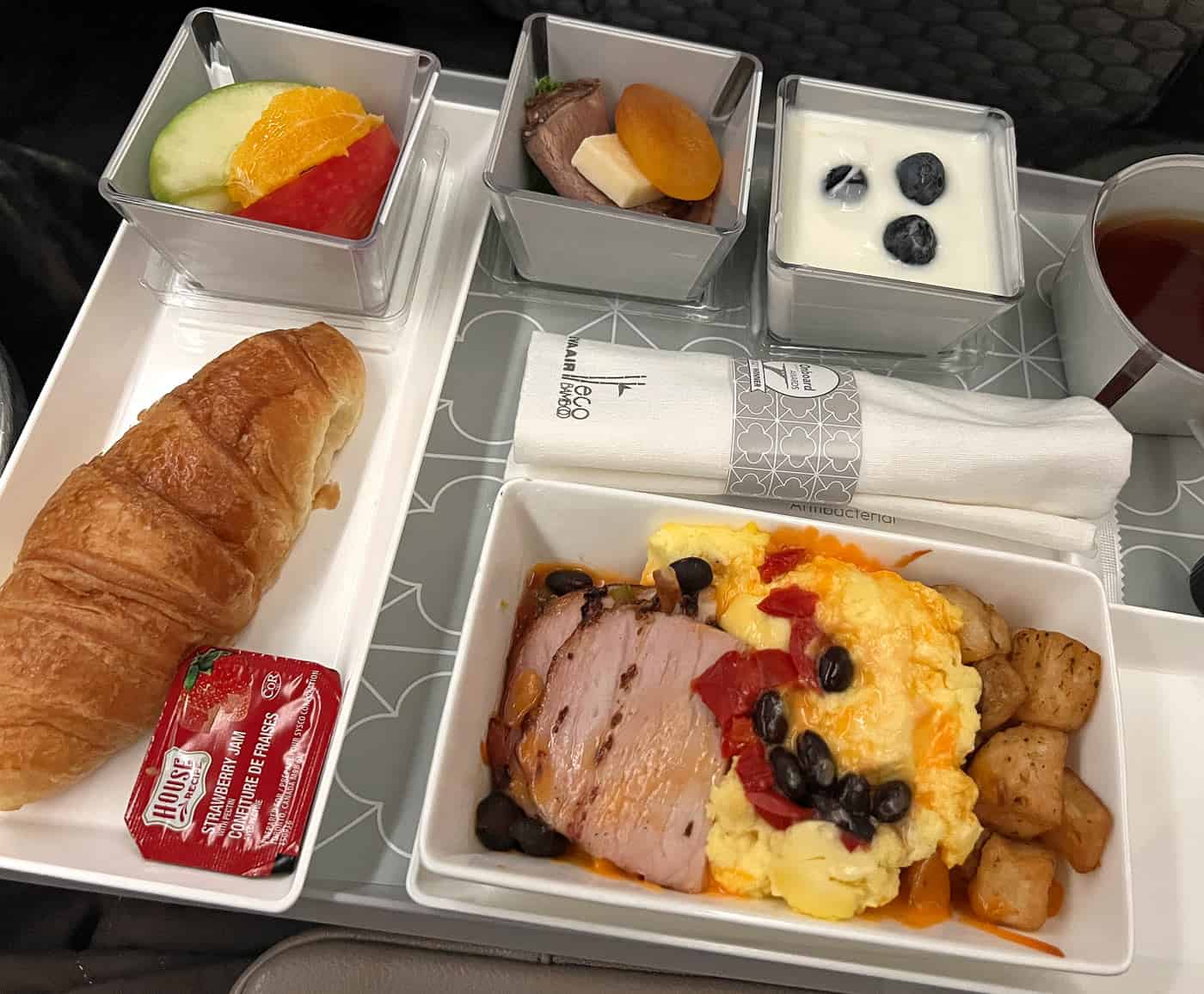 EVA Air Premium Economy breakfast of scrambled eggs, ham and potatoes
