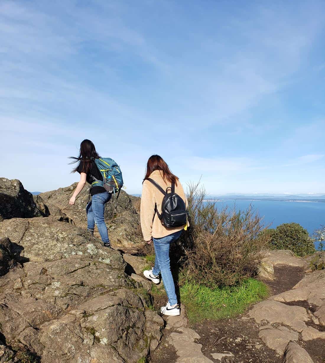 Two women hikers at the top of Mt. Doug