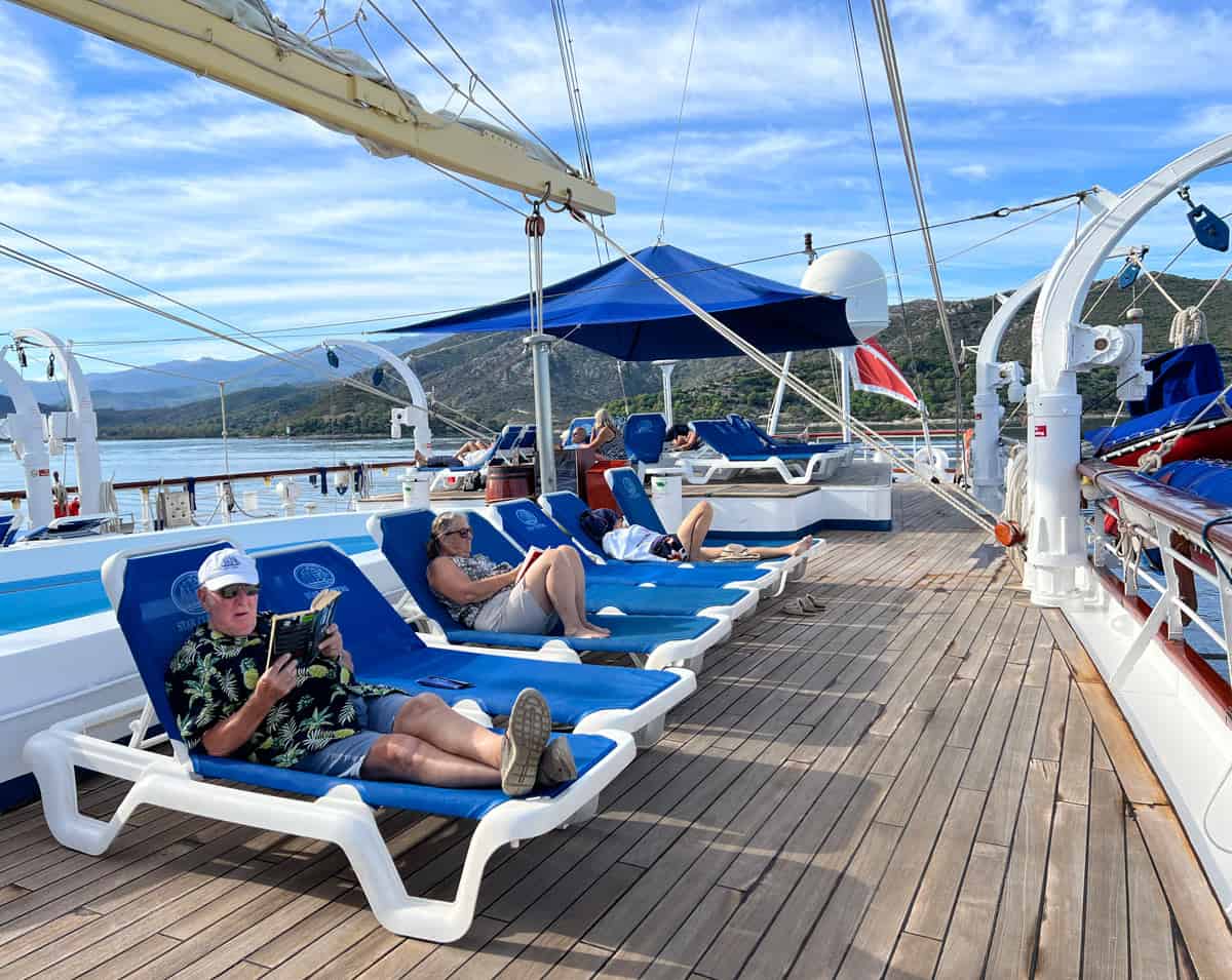 Passengers relax on deck aboard Star Flyer