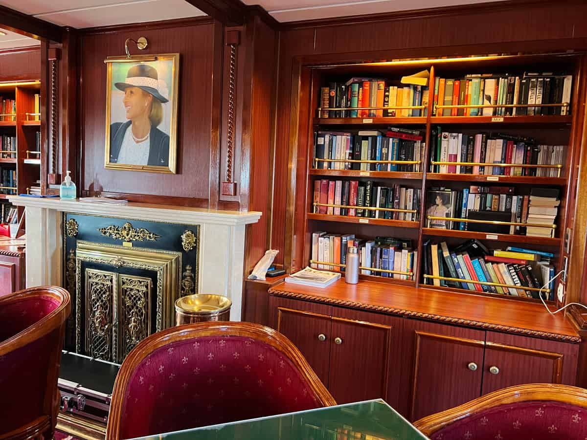 Red velvet chairs in wood-paneled library of Star Flyer