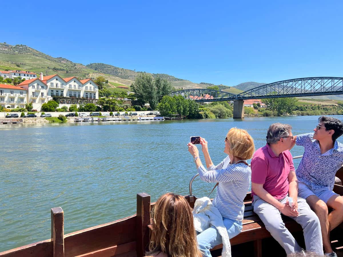 Passengers on a rabelo boat cruise in the Douro Valley