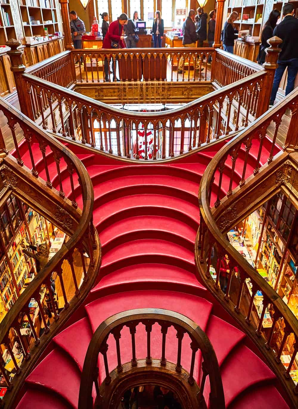 A rare sighting: Livraria Lello's famous red staircase with no people on it.