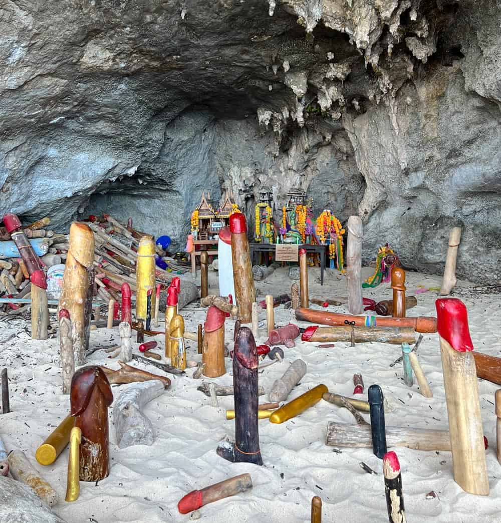 Colorful wooden phallus offerings inside Princess Cave, a fertility shrine on Railay